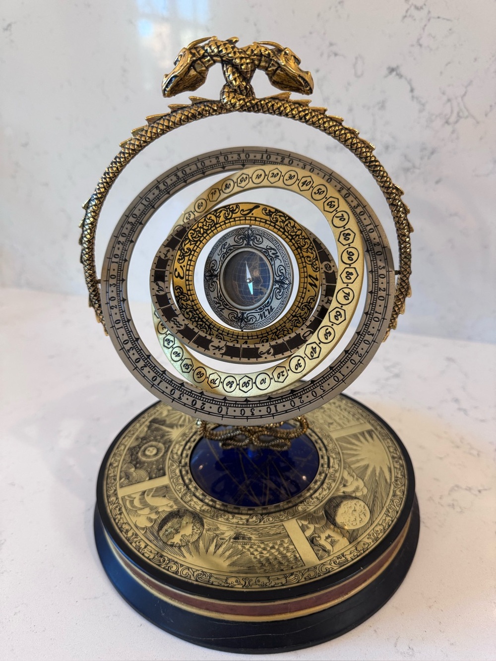 Decorative Gold and Blue Astrolabe-Inspired Wall Accent - the noble collection